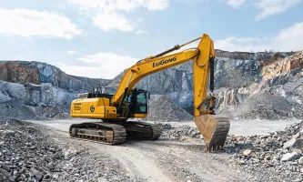 Earthmoving excavator on quarry haul road